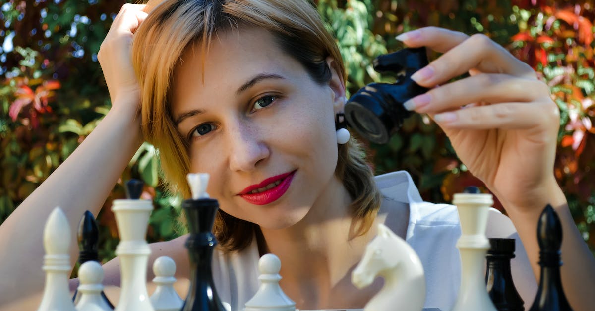 Check if player has item, if so remove it - Smiling woman with chess looking at camera