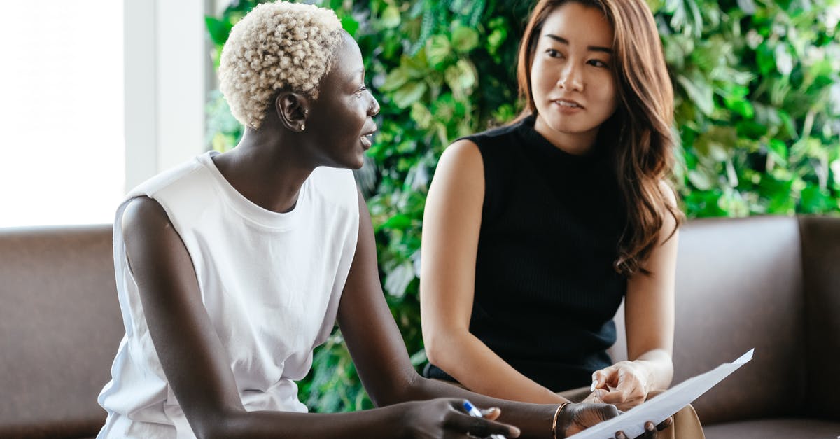 Check Minecraft Java scoreboard Leaderboards - Diverse women talking about job while discussing contract and looking at each other in conference hall