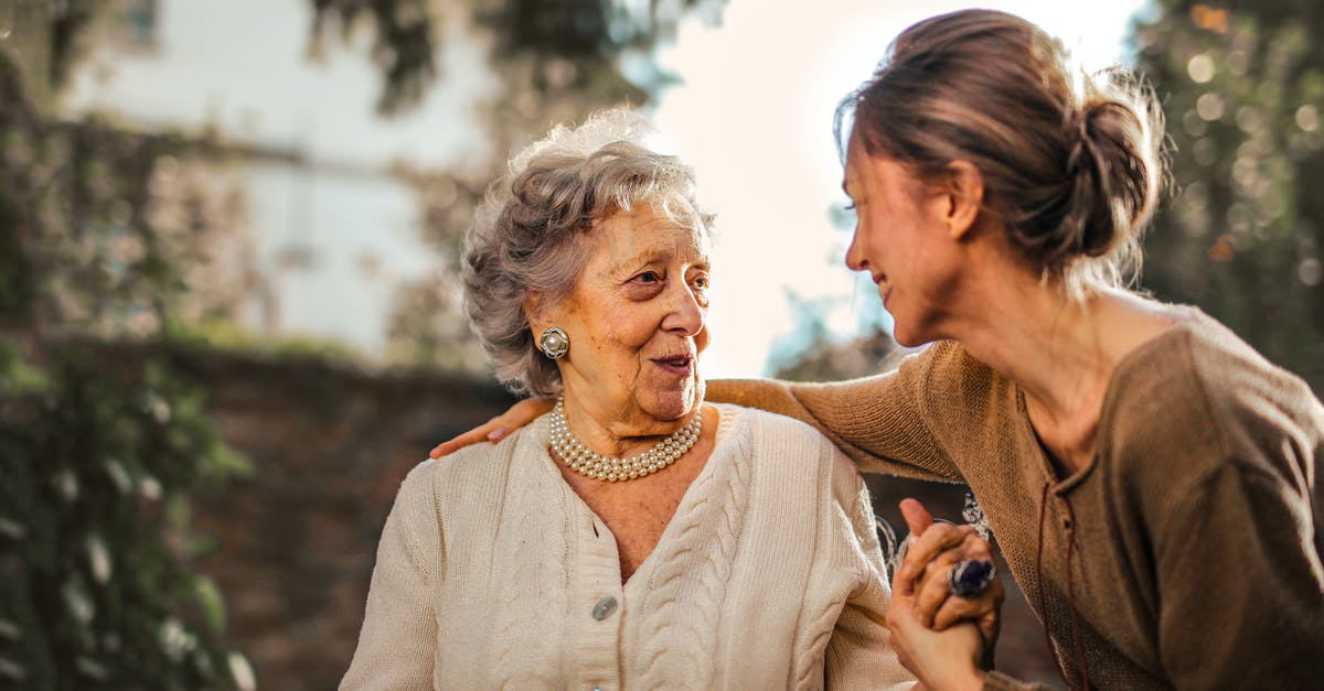Chronosphere interaction with slows and stuns - Joyful adult daughter greeting happy surprised senior mother in garden