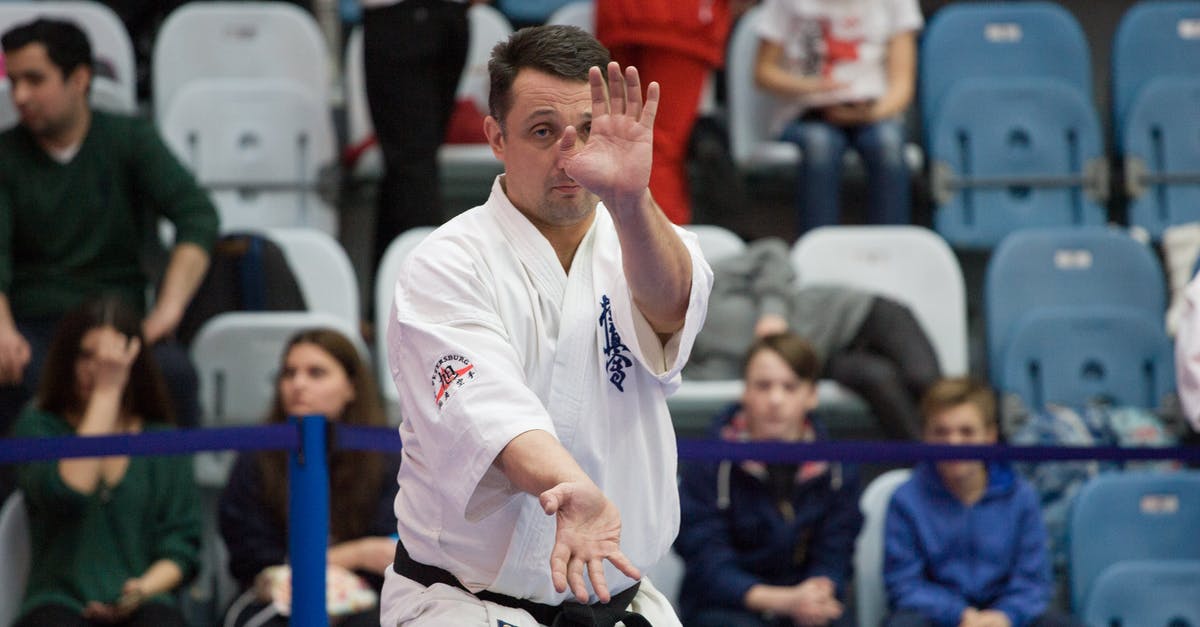 Circuitry to eliminate spectator mode - Man in White and Blue Long Sleeve Shirt Sitting on Chair