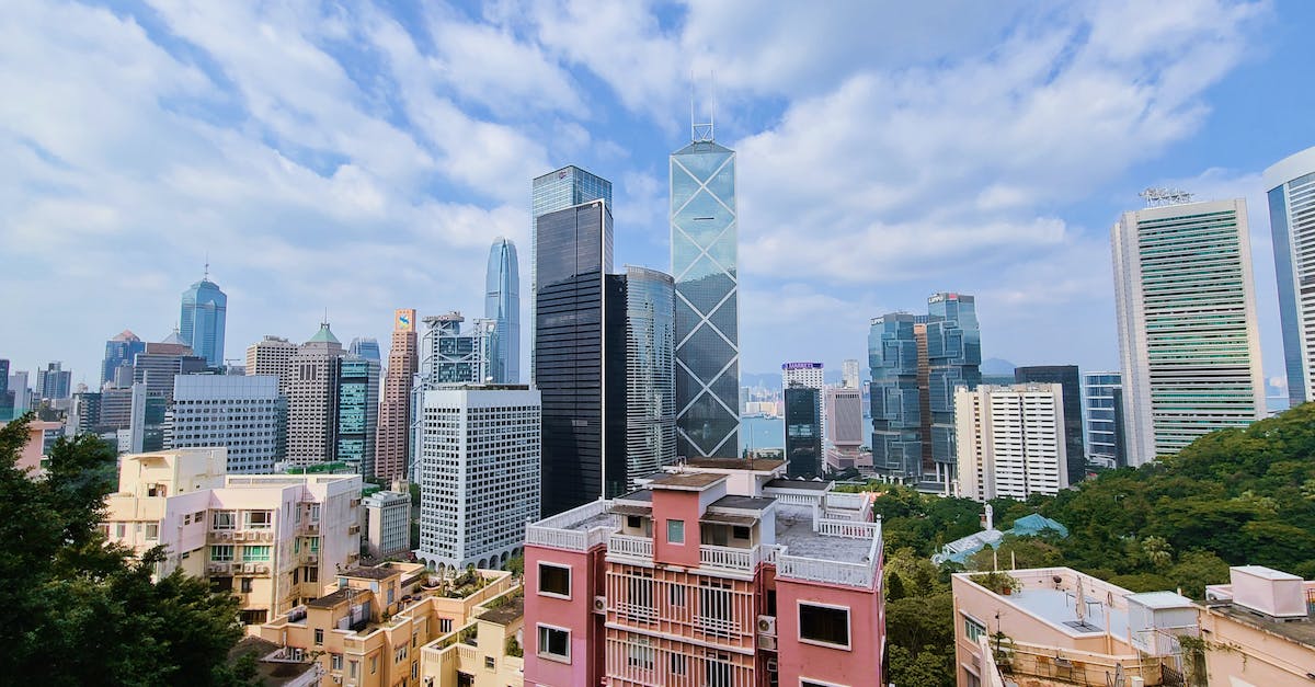Cities: Skyline fails to generate correct menu and crashes on exit - Red and White Concrete Buildings Under Blue Sky Cities: Skyline fails to generate correct menu and crashes on exit - Red and White Concrete Buildings Under Blue Sky