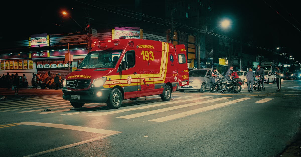 Cities Skylines crashes everytime I load my save game - Red emergency transport near  car crash on illuminated night street in modern city