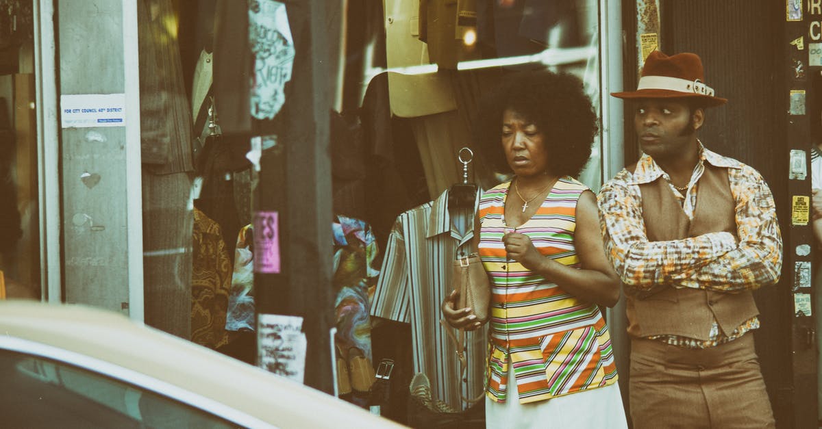 Cities-In-Motion-2 rule-set usage - Man and Woman Standing Near Beige Vehicle Cities-In-Motion-2 rule-set usage - Man and Woman Standing Near Beige Vehicle