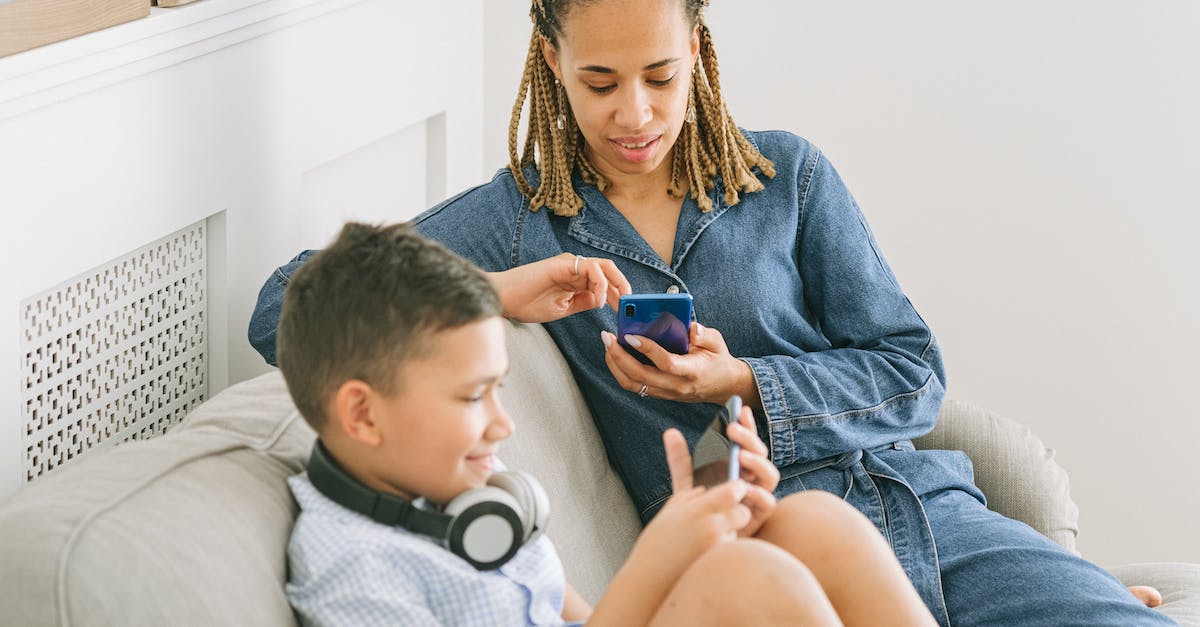 Clan I play two separate clash of clans bases on my ipad? [duplicate] - Woman in Blue Denim Jacket Sitting Beside a Boy 