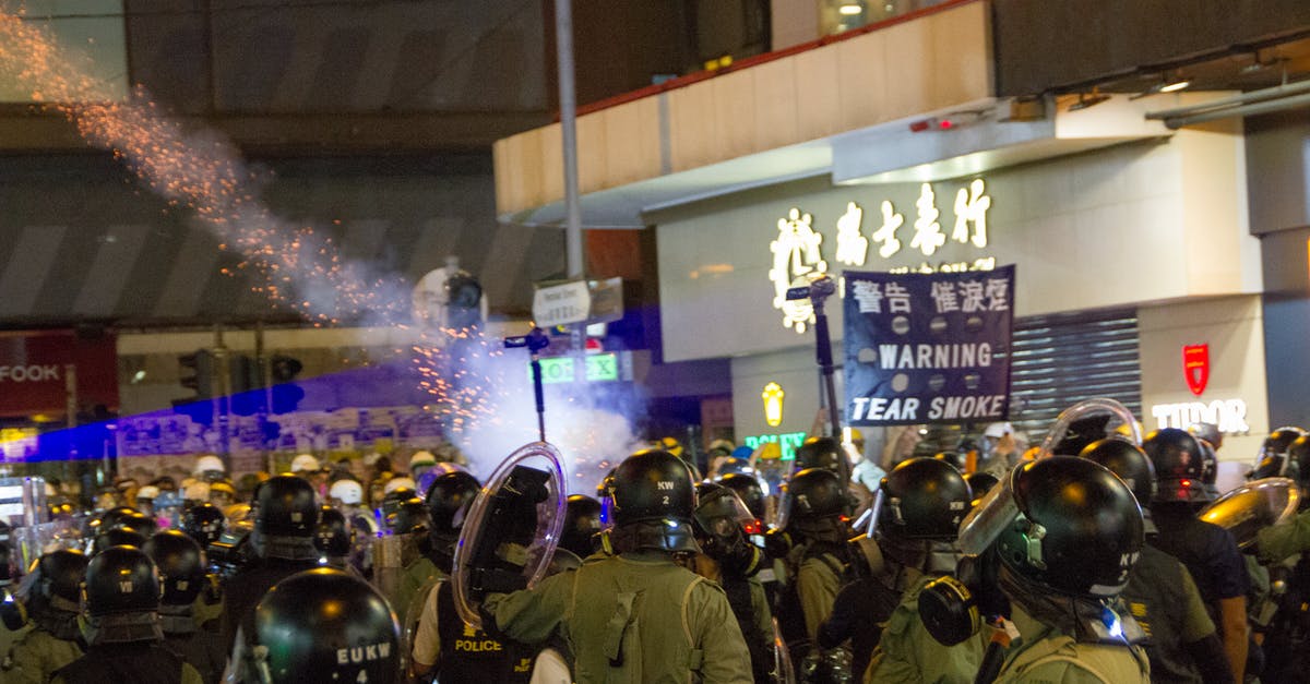 Clash of clans isn't loading? - Rally In The Street With Soldiers Wearing Black Helmets 