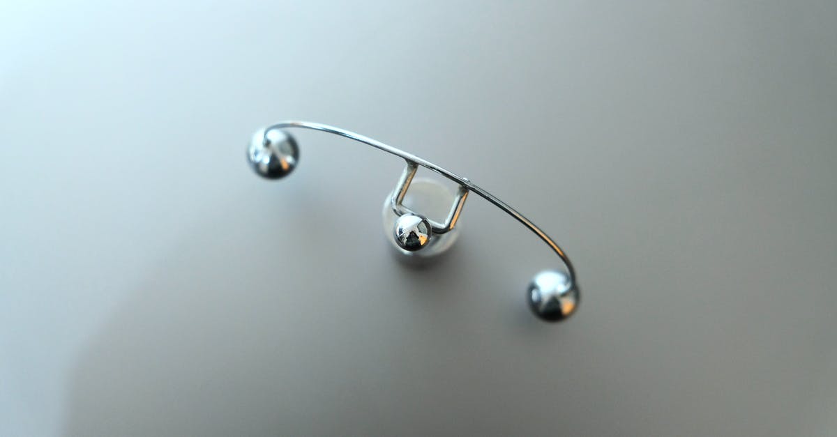 Clear a custom item from Inventory - Top view of metal pendulum device placed on white table in psychiatrical clinic Clear a custom item from Inventory - Top view of metal pendulum device placed on white table in psychiatrical clinic