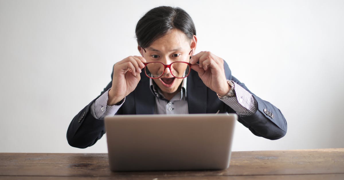 Click-Emerald reaction - Amazed formal male looking at laptop screen Click-Emerald reaction - Amazed formal male looking at laptop screen