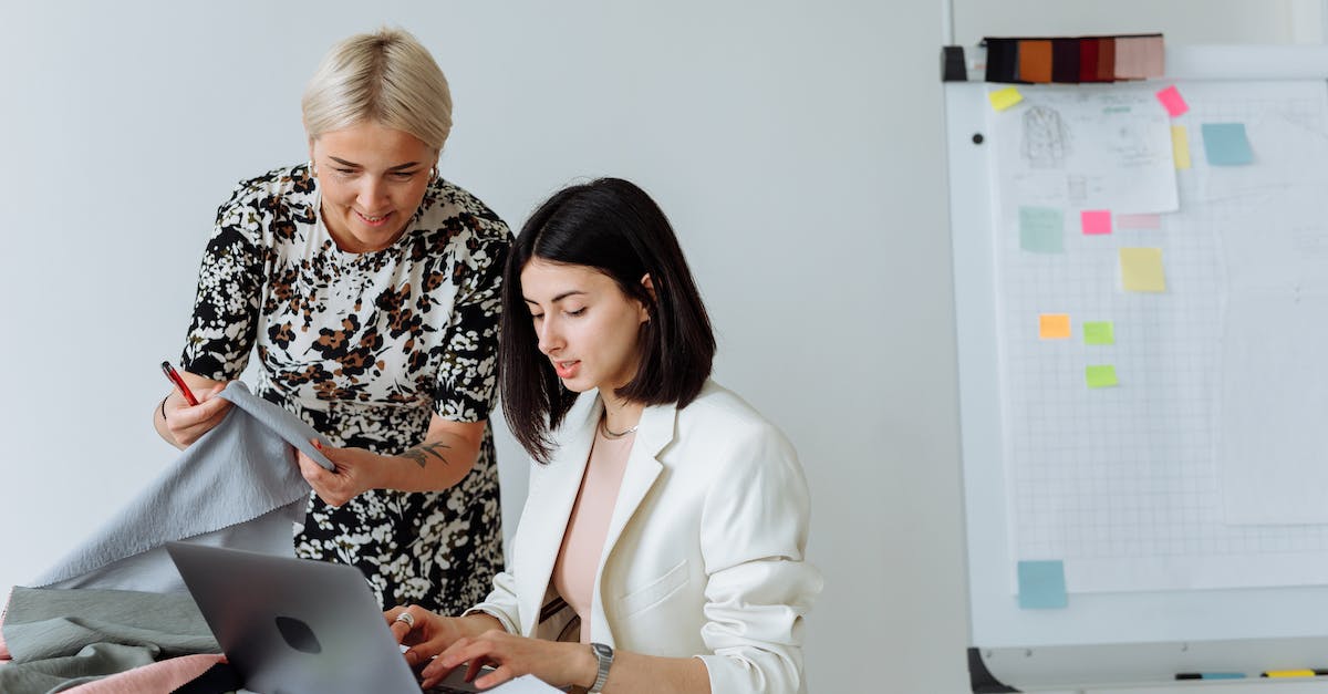Clothing and armor - Woman in Black and White Floral Long Sleeve Shirt Using Macbook