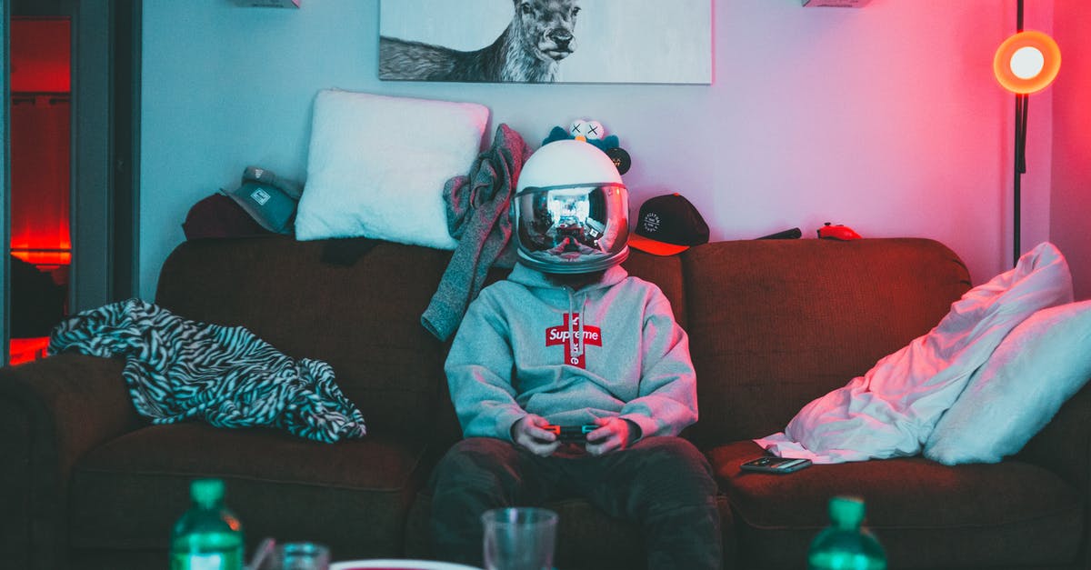 COD BO3 campaign 4 players, 2 consoles offline - Boy in virtual reality helmet playing joystick COD BO3 campaign 4 players, 2 consoles offline - Boy in virtual reality helmet playing joystick