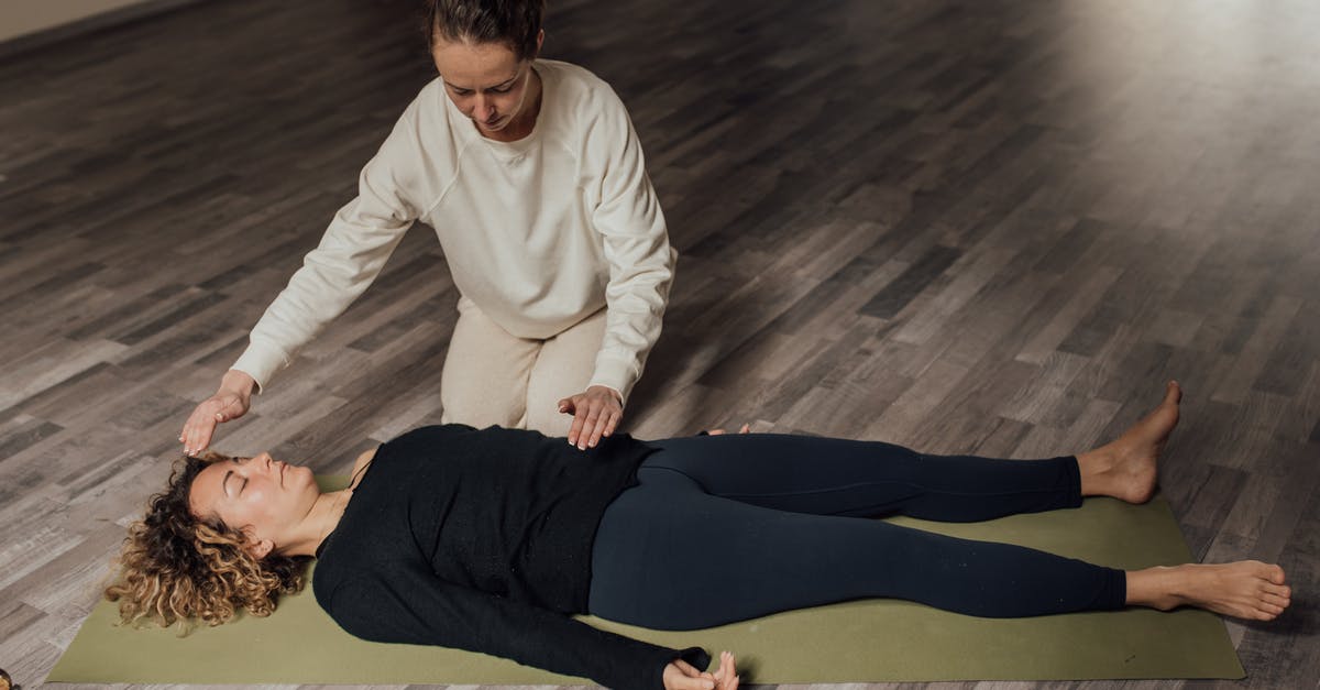 command creation: floor crafting help - Energy practitioner healing relaxed woman on yoga mat