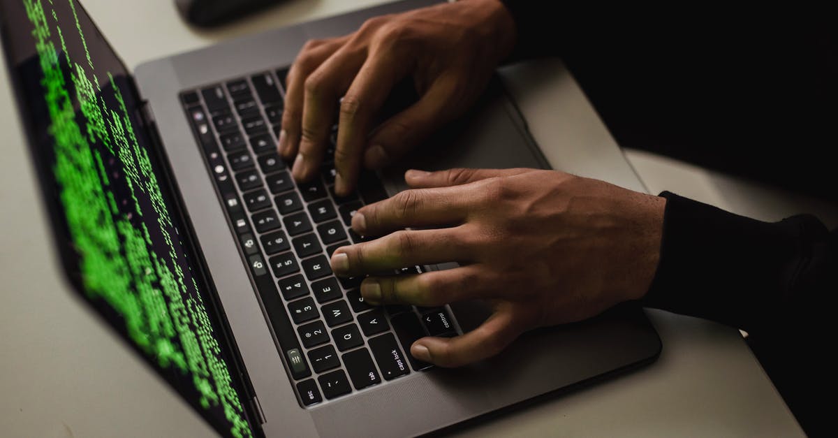 Command Headache - money system /w command blocks - From above of crop anonymous male hacker typing on netbook with data on screen while sitting at desk