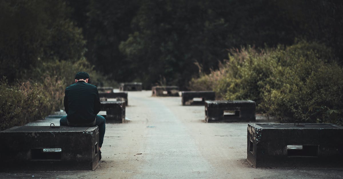 Concrete power problem - Man in Black Dress Shirt With Blue Denim Shirt Sitting on Black Concrete Bench Near Green Plants Concrete power problem - Man in Black Dress Shirt With Blue Denim Shirt Sitting on Black Concrete Bench Near Green Plants