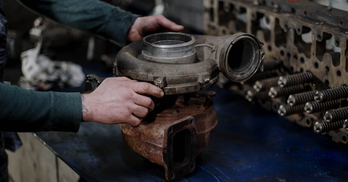Conditions for turbo boost fail? - Person Holding a Engine Turbo