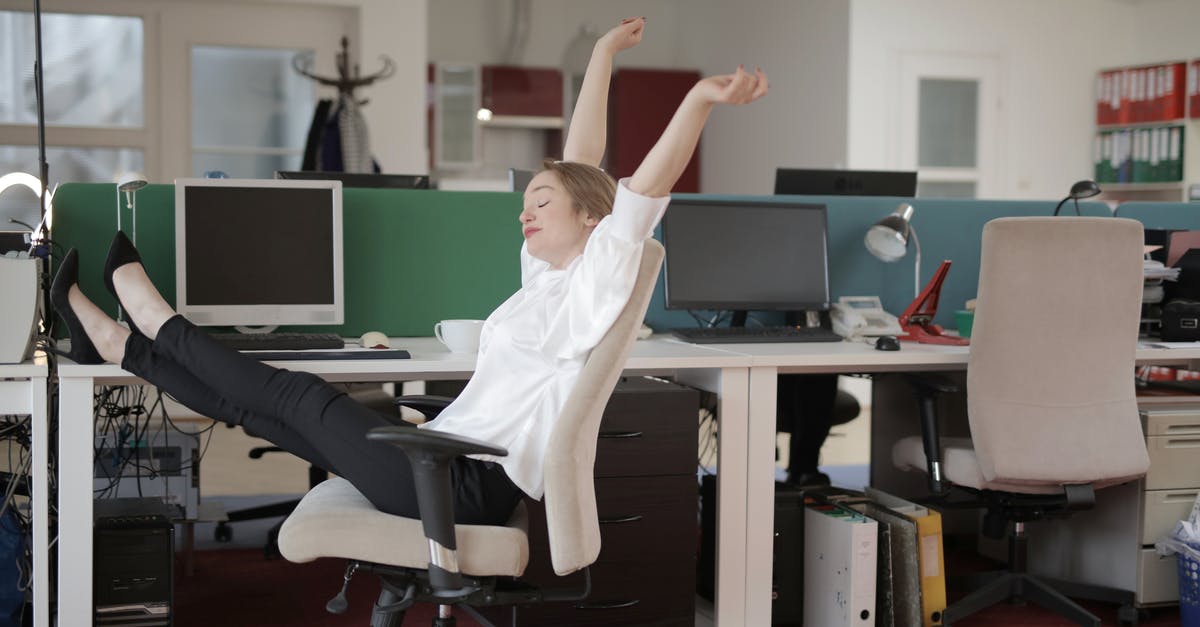 Configuring QuiverBow's Arms Assistant - Side view of cheerful female employee in formal outfit sitting on office chair with crossed legs on desk and stretching while resting during work with closed eyes Configuring QuiverBow's Arms Assistant - Side view of cheerful female employee in formal outfit sitting on office chair with crossed legs on desk and stretching while resting during work with closed eyes