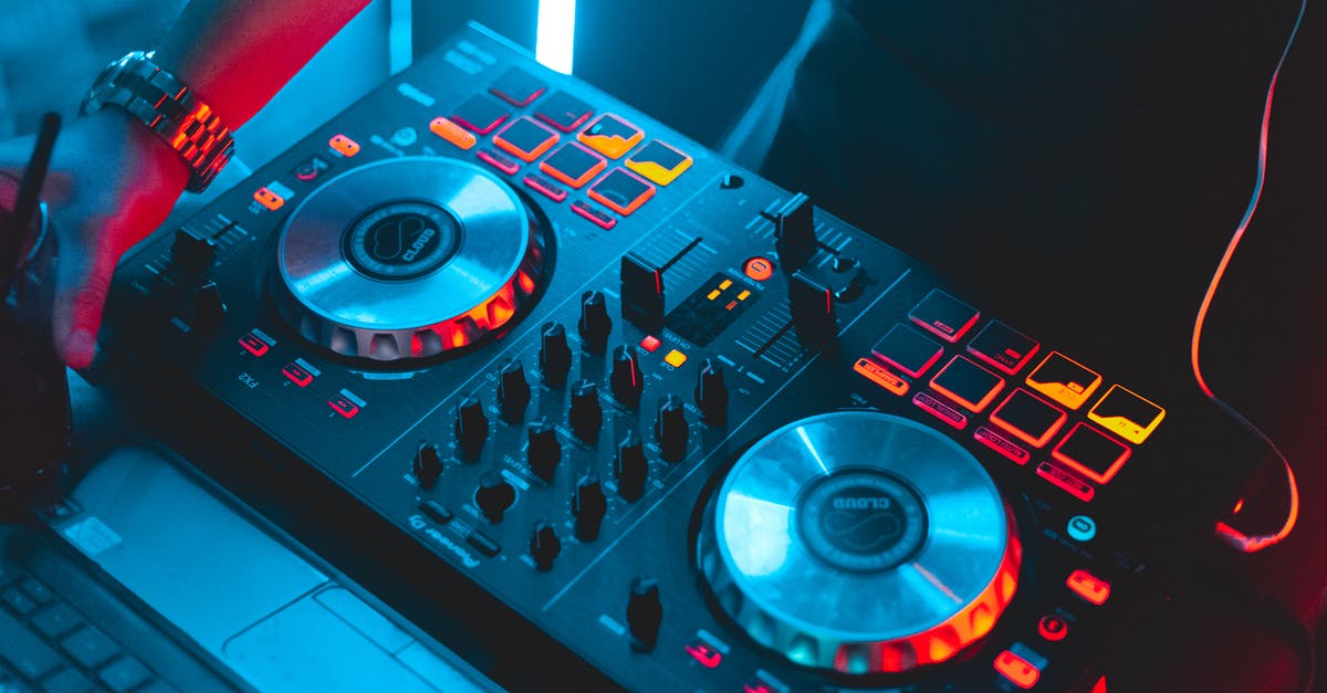 Console Message: Set score of cat for player [player guid] to # - From above of unrecognizable male disk jockey standing near DJ jog wheels near laptop while playing music in modern nightclub