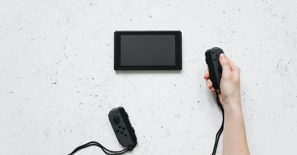 Controller Controls? - Black Smartphone Beside Black Smartphone Controller Controls? - Black Smartphone Beside Black Smartphone