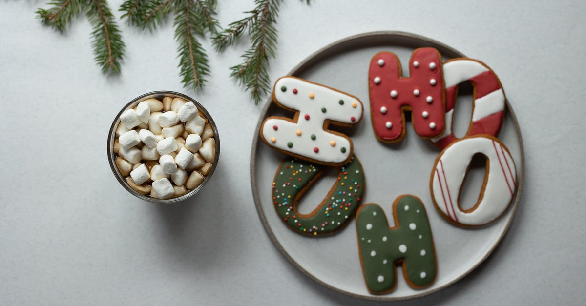 Cookie Clicker- [Last chance to see] and [All natural sugar cane] shadow achievements - Overhead view of tasty biscuits in form of letters with decor near hot drink with marshmallows and fir sprig during New Year holiday