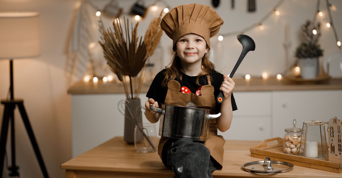 Cooking pot spawned and moved through commands not interactable - Little Girl Dressed as a Chef Sitting on a Kitchen Counter Holding a Pot and a Soup Spoon 
