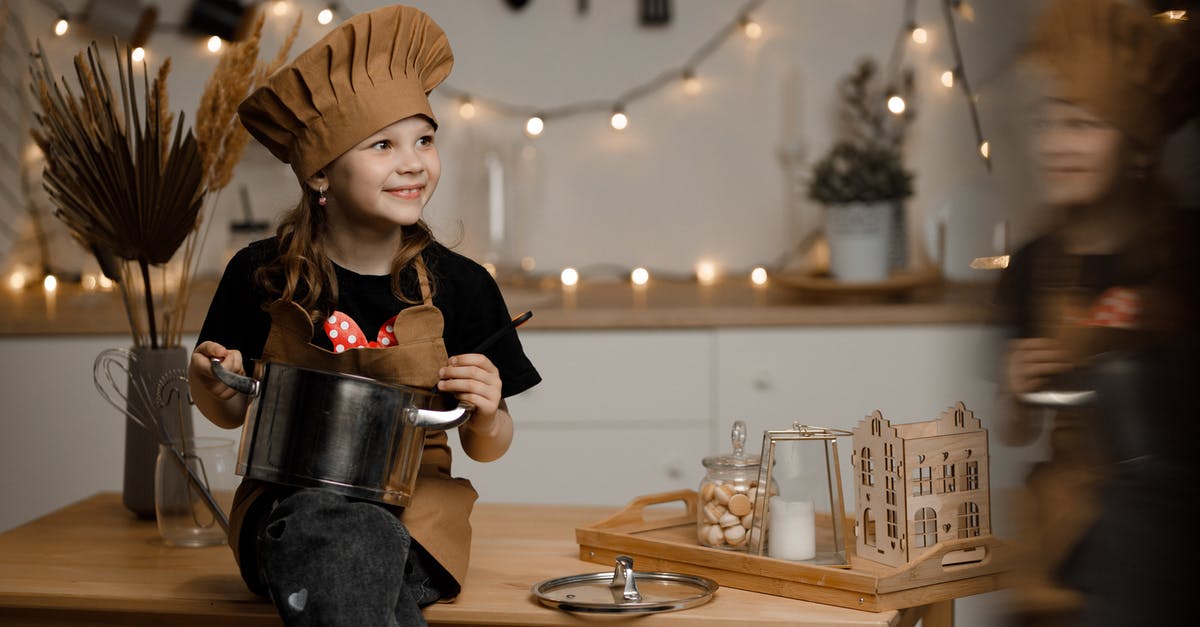 Cooking pot spawned and moved through commands not interactable - Little Girl Dressed as a Chef Sitting on a Kitchen Counter Holding a Pot and a Soup Spoon 