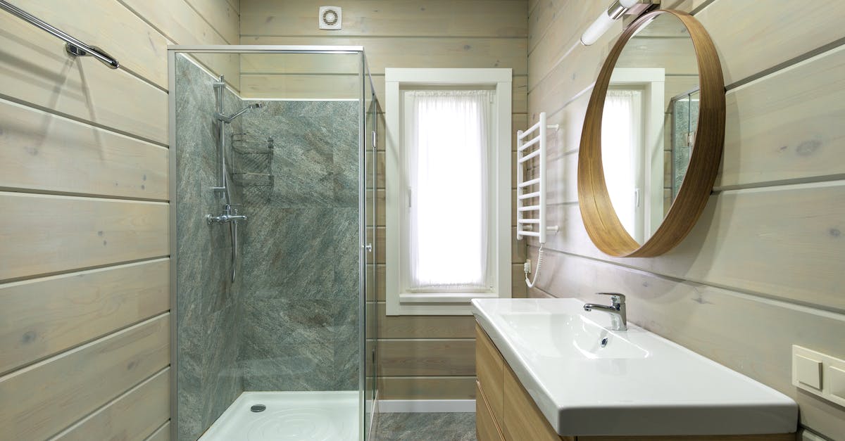 Cooldown reset when deploying Heat Sink mod? - Contemporary bathroom design with round mirror hanging above sink and shower cabin near window and paneled walls