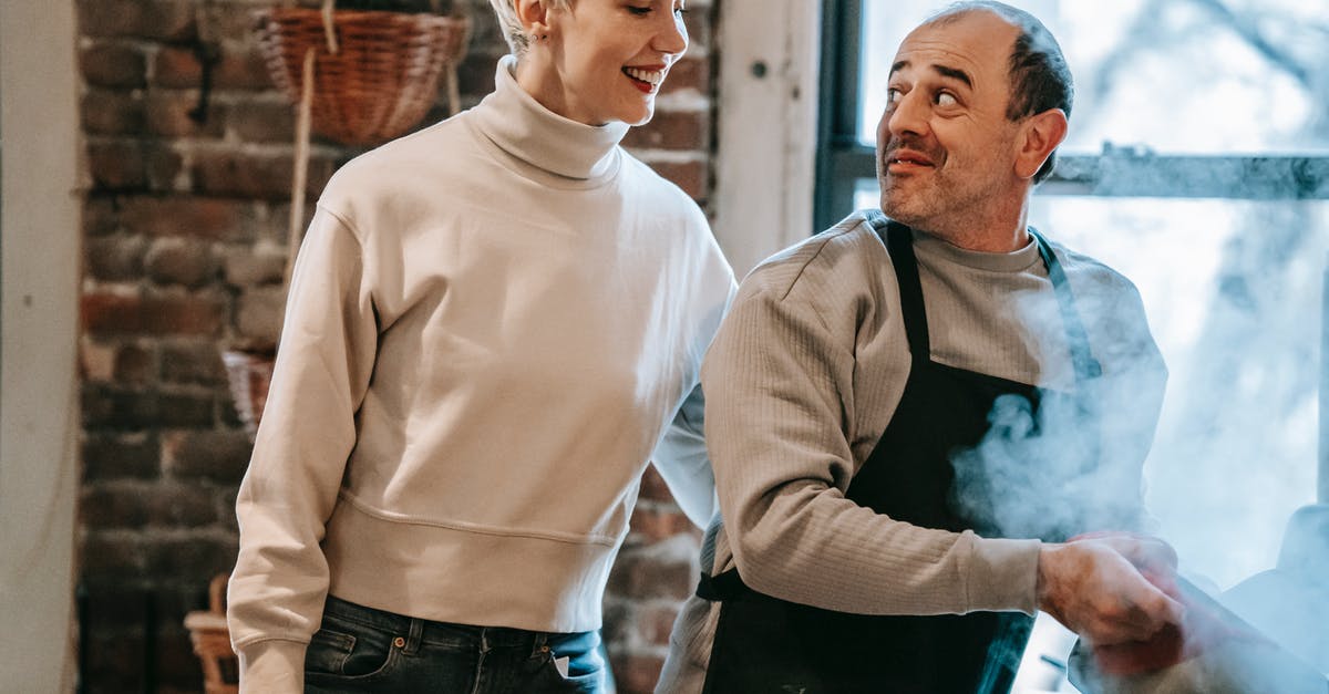 Copy steam games to other PCs - Crop joyful adult woman embracing smiling ethnic husband in casual clothes and apron preparing tasty food in saucepan in kitchen Copy steam games to other PCs - Crop joyful adult woman embracing smiling ethnic husband in casual clothes and apron preparing tasty food in saucepan in kitchen