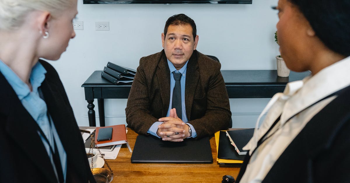 Cost scaling and optimal strategy for synthesis - Group of multiethnic colleagues communicating in office