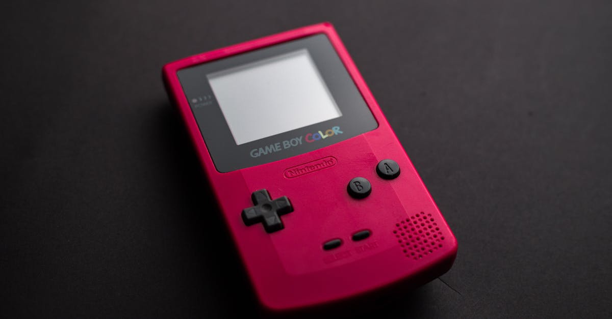 Could Removing A Nintendo Game Boy Game While The Console Is Powered-On Do Any Damage? - Close-up Photo of Red Game Boy Console Could Removing A Nintendo Game Boy Game While The Console Is Powered-On Do Any Damage? - Close-up Photo of Red Game Boy Console