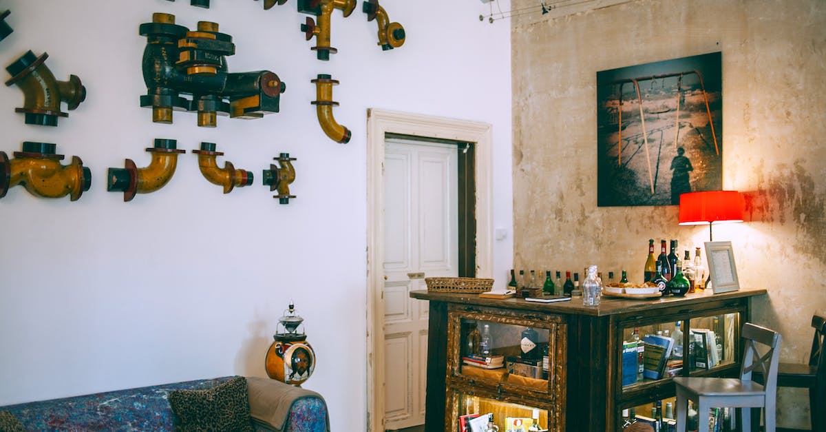 Could you pipe items In and Out of the AE grindstone? - Comfortable retro styled room with metal pipes on wall near vintage table with various glass bottles