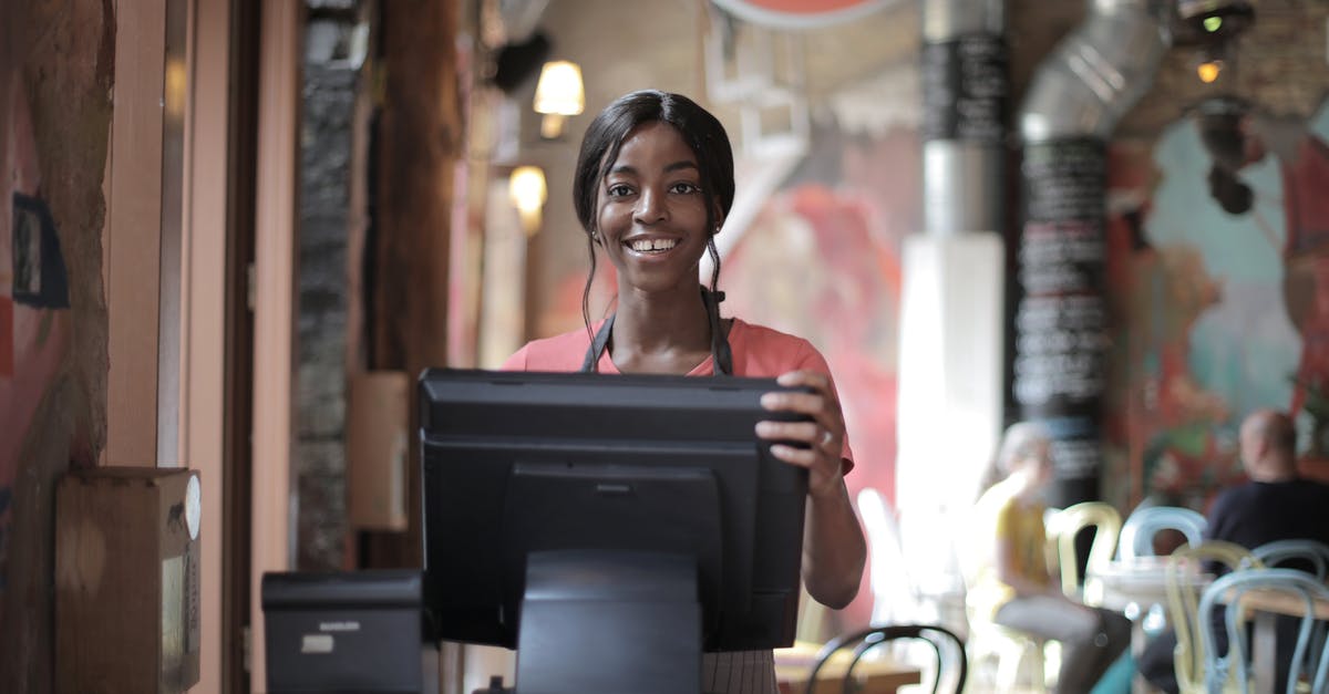 Counter strike condition zero - How to get current position/coordinate - Positive young woman in uniform smiling while standing at counter desk in cafe Counter strike condition zero - How to get current position/coordinate - Positive young woman in uniform smiling while standing at counter desk in cafe
