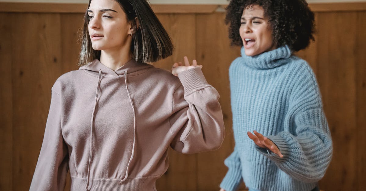 CraftBukkit ignoring eula.txt - Mad African American female in warm sweater screaming at irritated female while having argument in light room with wooden walls CraftBukkit ignoring eula.txt - Mad African American female in warm sweater screaming at irritated female while having argument in light room with wooden walls