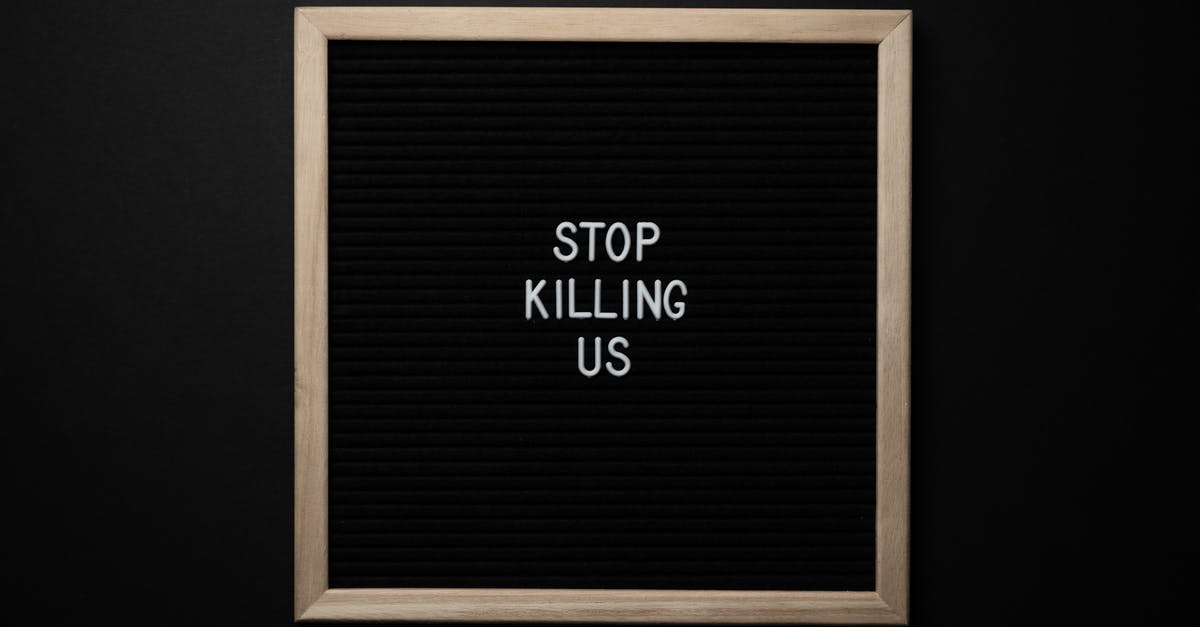 Creating a quest, problem with chips for pass weapons from subroom to subroom - Top view of slogan Stop Killing Us on surface of square blackboard on black background
