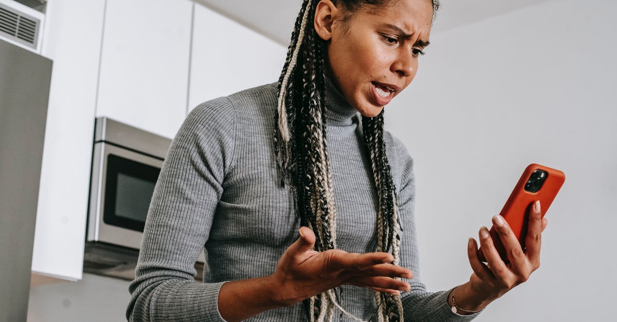 Creating a quest, problem with chips for pass weapons from subroom to subroom - Annoyed black woman having video chat on smartphone at home