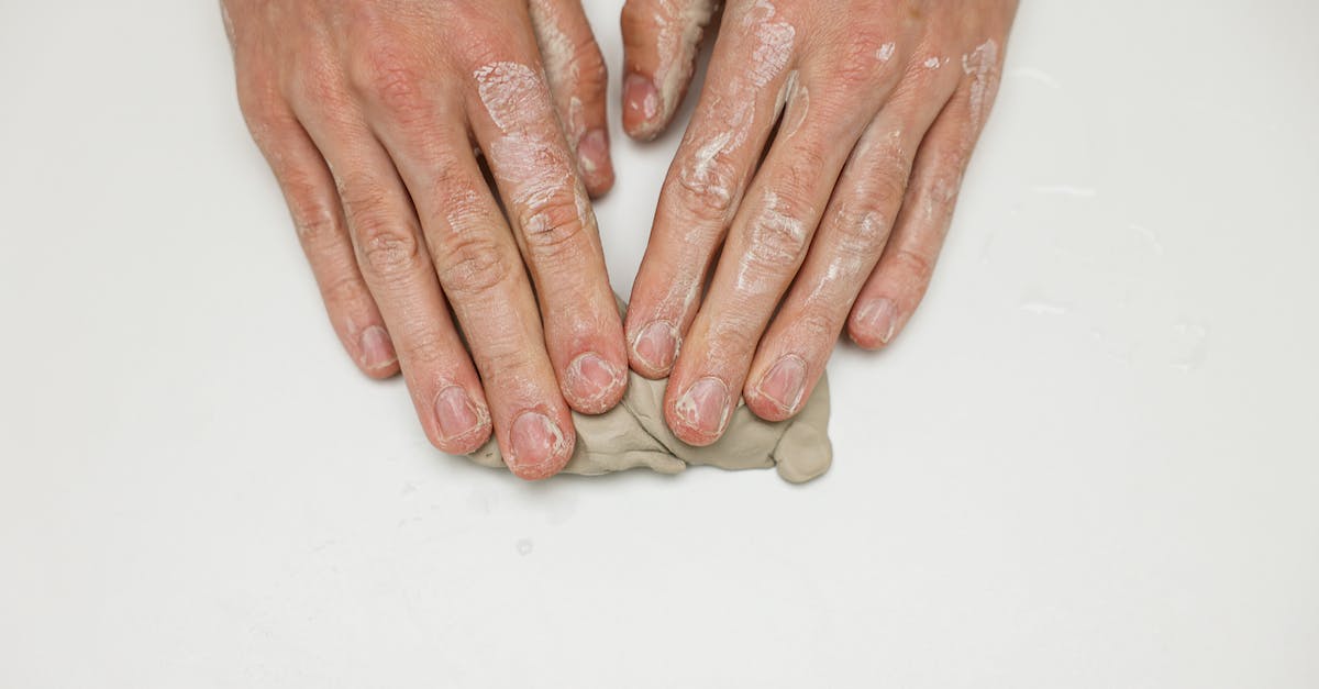 Creating a "custom" Caladbolg - Persons Hand on White Table