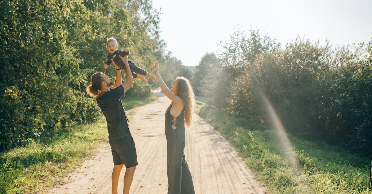 Crime.Net Offline Play? - Man in Black T-shirt and Black Shorts Carrying Woman in Black Dress on Road during