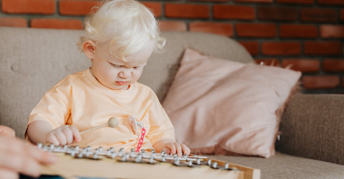 Crime.Net Offline Play? - Child in Orange Crew Neck Shirt Playing on Brown Wooden Table Crime.Net Offline Play? - Child in Orange Crew Neck Shirt Playing on Brown Wooden Table