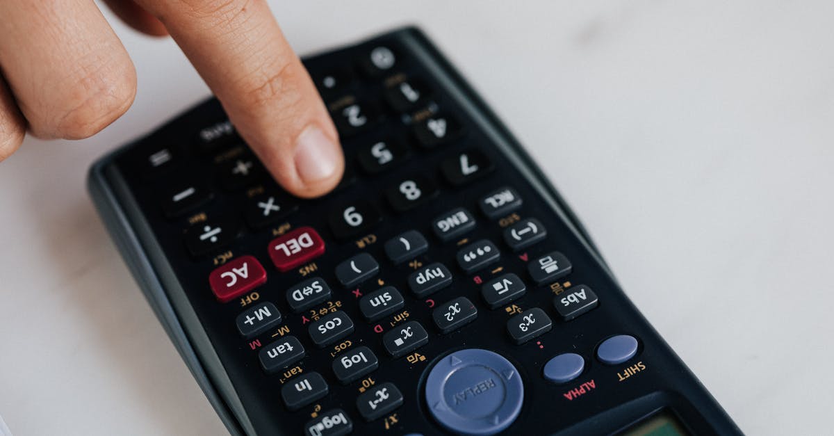 Crusader Kings 2 From Count to a Duchy - From above of crop anonymous economist calculating on calculator with plastic buttons while making budget on marble table