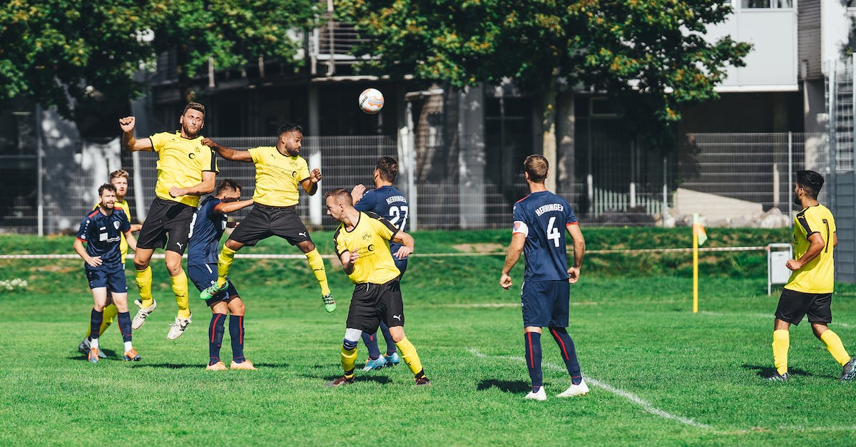 CS:GO kick/ban in competitive match making - Young sportsmen playing football on outdoor field CS:GO kick/ban in competitive match making - Young sportsmen playing football on outdoor field