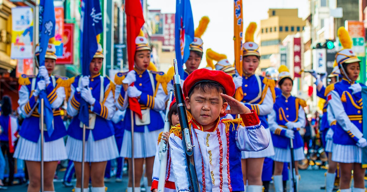 CS:GO Weapon inspection - Girl in Blue and White Long Sleeve Dress Holding Stick With People in the Background during