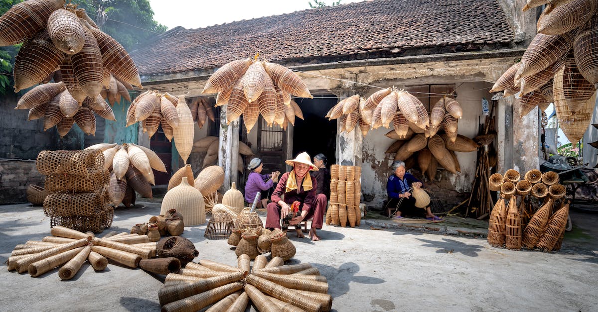 Culture building destroyed (not disabled) if I build one as different culture? - Many traditional Vietnamese timber wicker fish traps near rural residential building and aged ethnic people