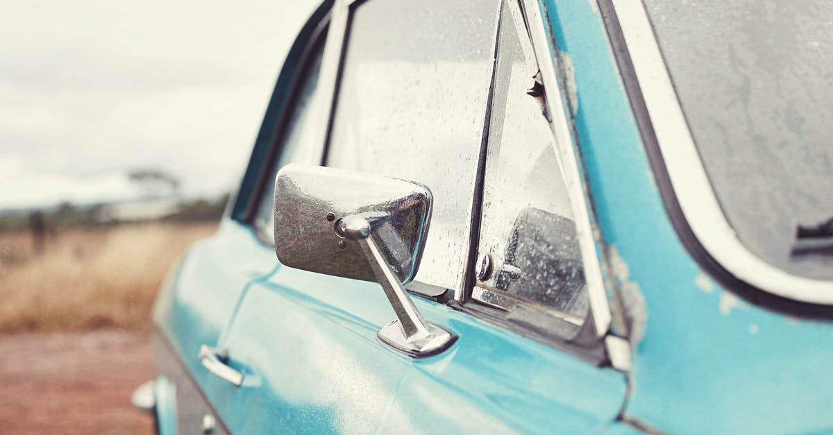 Custom Data model shows old textures but slighty darkened - Old blue retro car after rain parked in countryside against cloudy sky in overcast weather Custom Data model shows old textures but slighty darkened - Old blue retro car after rain parked in countryside against cloudy sky in overcast weather