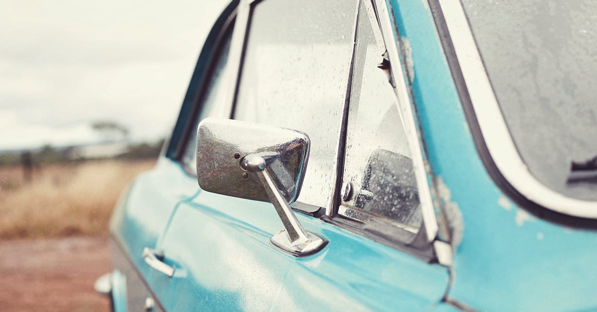 Custom Data model shows old textures but slighty darkened - Old blue retro car after rain parked in countryside against cloudy sky in overcast weather