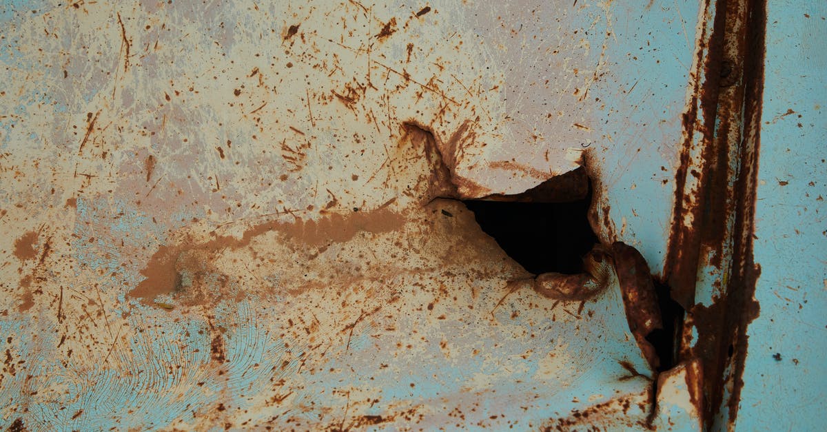 D3 Weapon Damage Physical Damage - Old rusty metal surface of blue color with scratches and hole in abandoned building