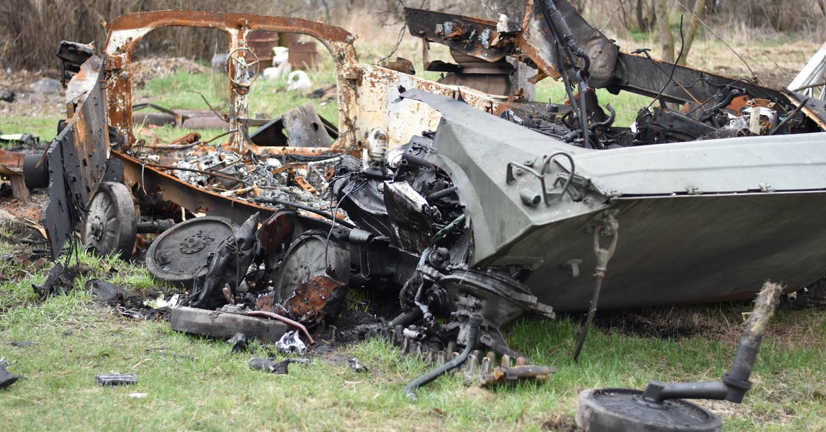 Damaging AT-ATs on Hoth - Wrecked Car on Green Grass Field Damaging AT-ATs on Hoth - Wrecked Car on Green Grass Field