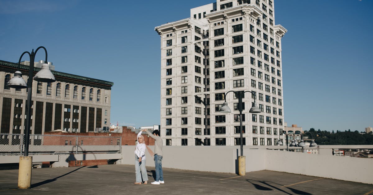 Dancing with Healing Vision Angelic Mix without turning into a pretzel - A Couple Dancing Together on a Rooftop Building