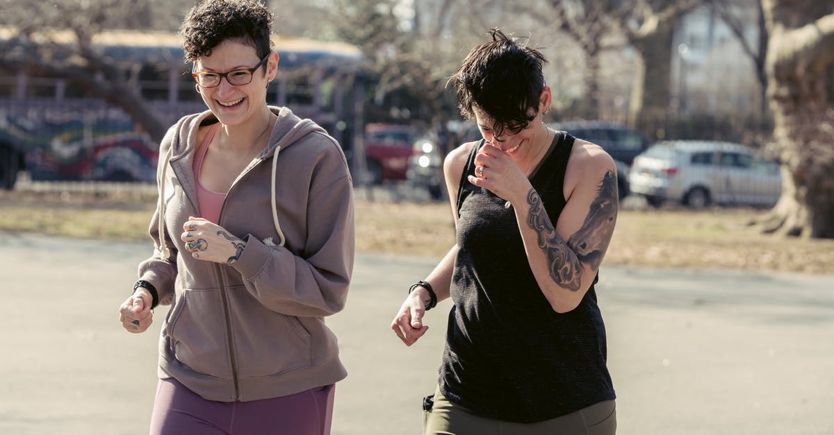 Daredevil Run not appearing - Happy women in sportswear running on street Daredevil Run not appearing - Happy women in sportswear running on street