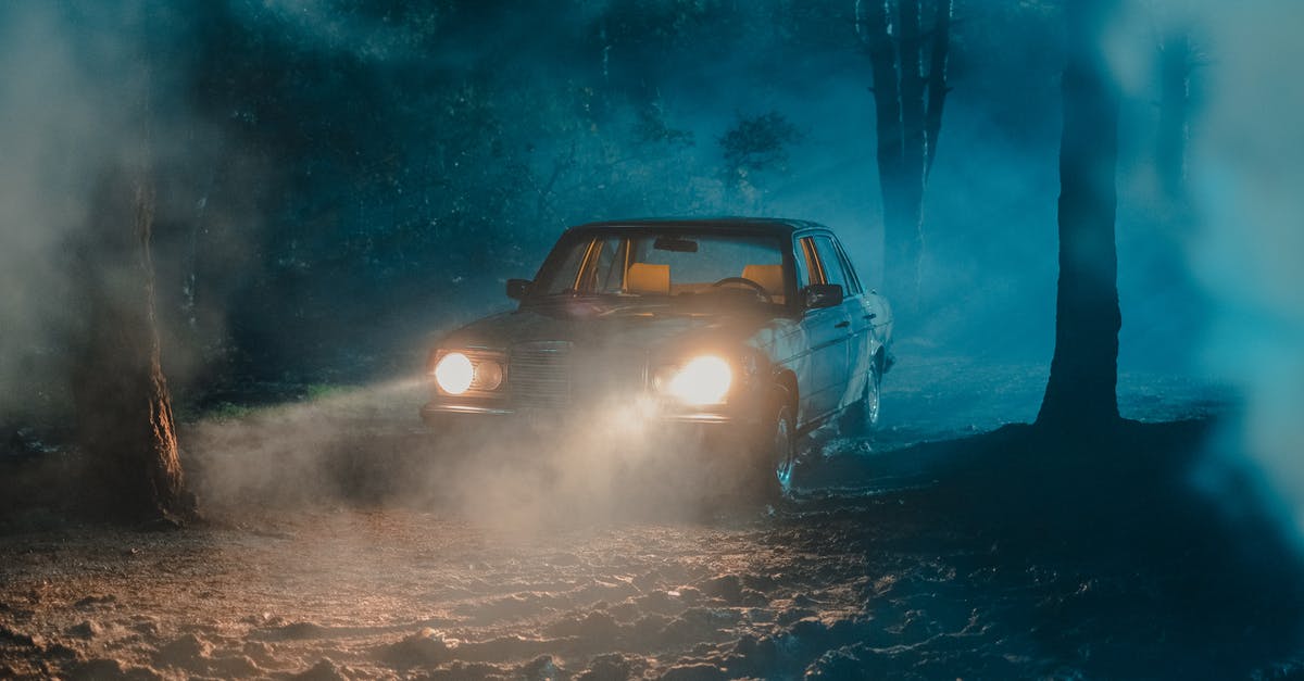 Dark Souls 2 - NG+ - Does it overwrite old save? - Old fashioned car with luminous headlights in dark forest