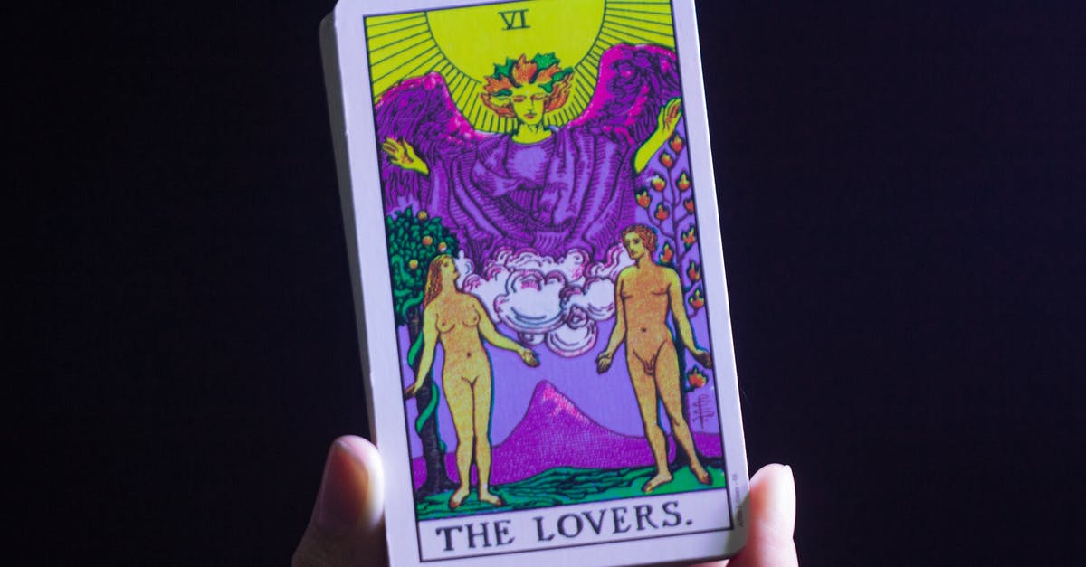 Dark Souls 3: Special ability / parry (L2 on ps4) sometimes triggers unintentionally. Why? - Unrecognizable person fortune teller demonstrating The Lovers tarot card in hand while doing card reading on black background in room