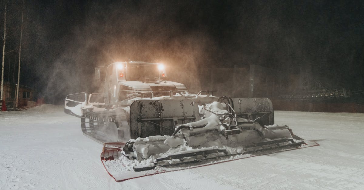 Dark Souls 3: Special ability / parry (L2 on ps4) sometimes triggers unintentionally. Why? - Modern massive snowcat with headlights driving and preparing slope for skiing in evening time