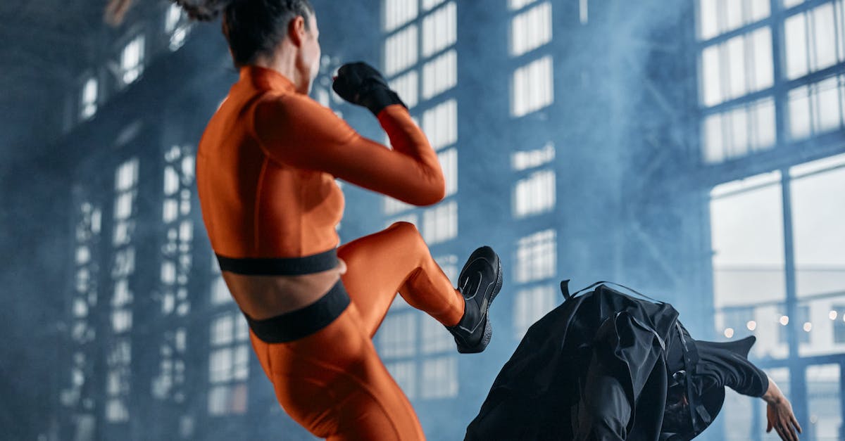 Dealing with 4 attack as Priest - Woman in Orange and Black Long Sleeve Shirt and Pants Fighting