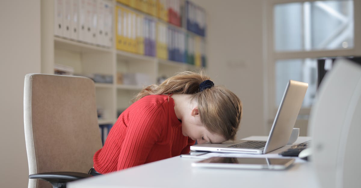 Defeating Kuvas? - Woman Sitting on Chair While Leaning on Laptop Defeating Kuvas? - Woman Sitting on Chair While Leaning on Laptop